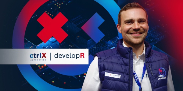 Portrait view of a ctrlX developR in front of a colorful background with the caption "ctrlX AUTOMATION Smiley".