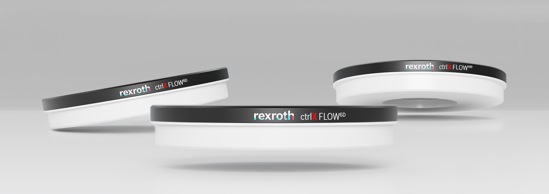 Drei Werkstückträger des berührungslosen Planarsystems ctrlX FLOW6D, welches Bewegungen in 6 Freiheitsgraden wie simultanes Drehen, Fahren und Neigen ermöglicht